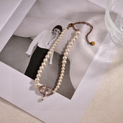 CD 26S PEARL STRAND CD CRYSTAL LOGO DROP NECKLACE IN GOLD TONE METAL 631858