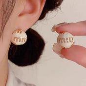 MIUMIU 26S MIU CRYSTAL LOGO STUD EARRINGS IN WHITE ENAMEL AND GOLD TONE METAL 633129