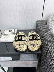 CHANEL 26S PLATFORM SLIDE SANDALS IN BEIGE AND BLACK SHEARLING DALMATIAN PRINT