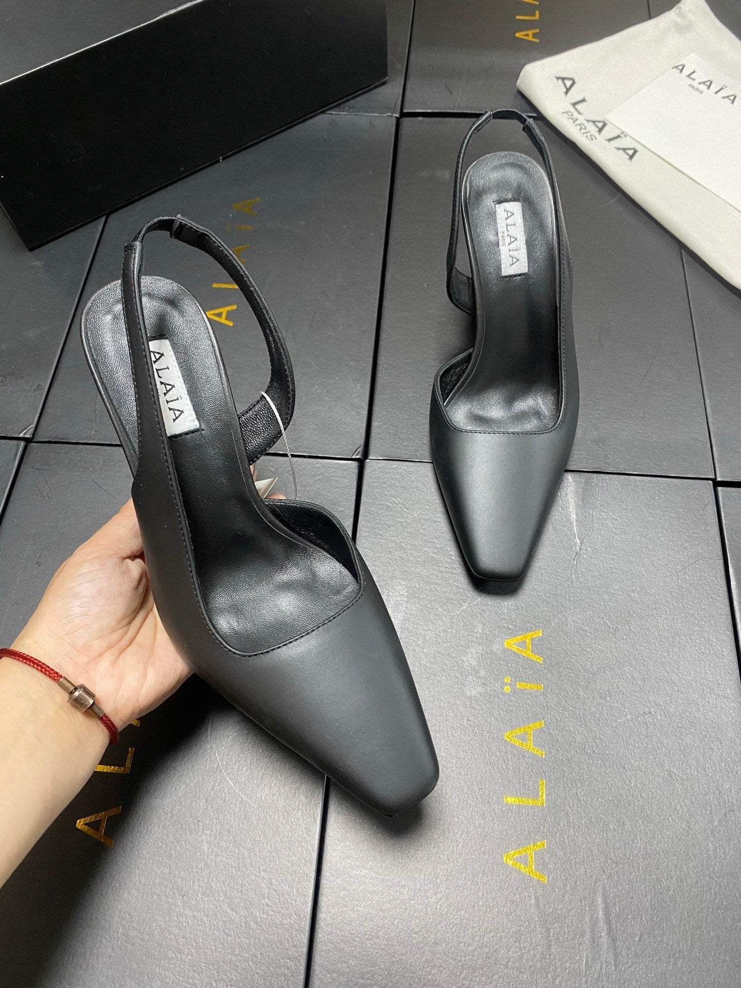 ALAIA 26S WEDGE SLINGBACKS 95 MM IN BLACK CALFSKIN