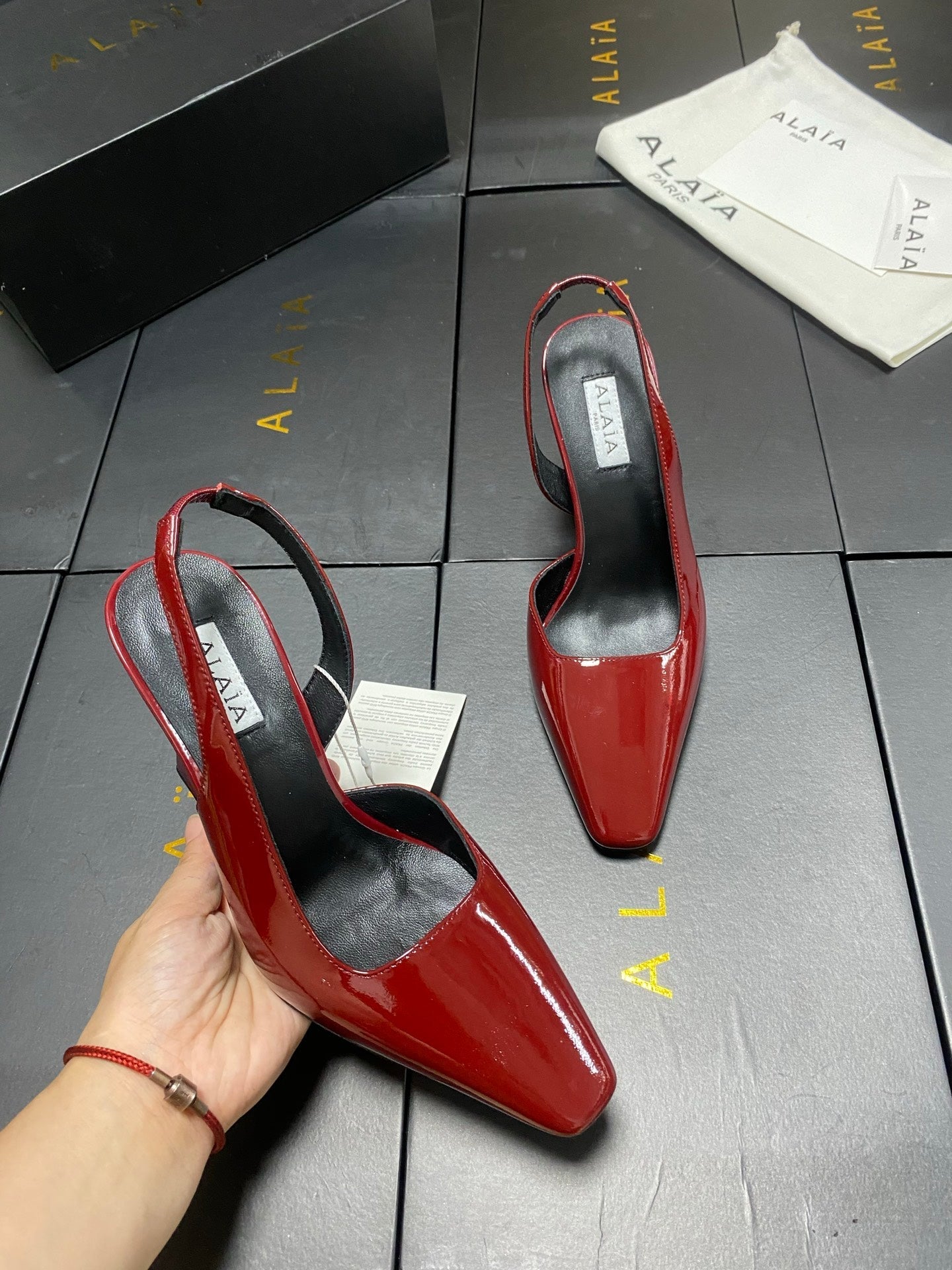 ALAIA 26S WEDGE SLINGBACKS 95 MM IN DARK RED PATENT CALFSKIN