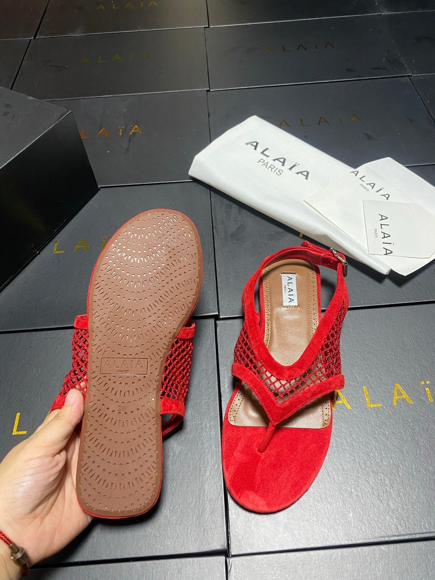 ALAIA 26S FLAT MESH THONG SANDALS IN RED SUEDE