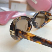 MIUMIU 26S OVAL FRAME IN ACETATE 415247