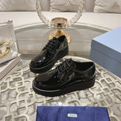 PRADA 26S LOAFERS IN BLACK PATENT CALFSKIN