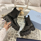 PRADA 26S MONOLITH CHELSEA BOOTS IN BLACK PATENT CALFSKIN AND FABRIC