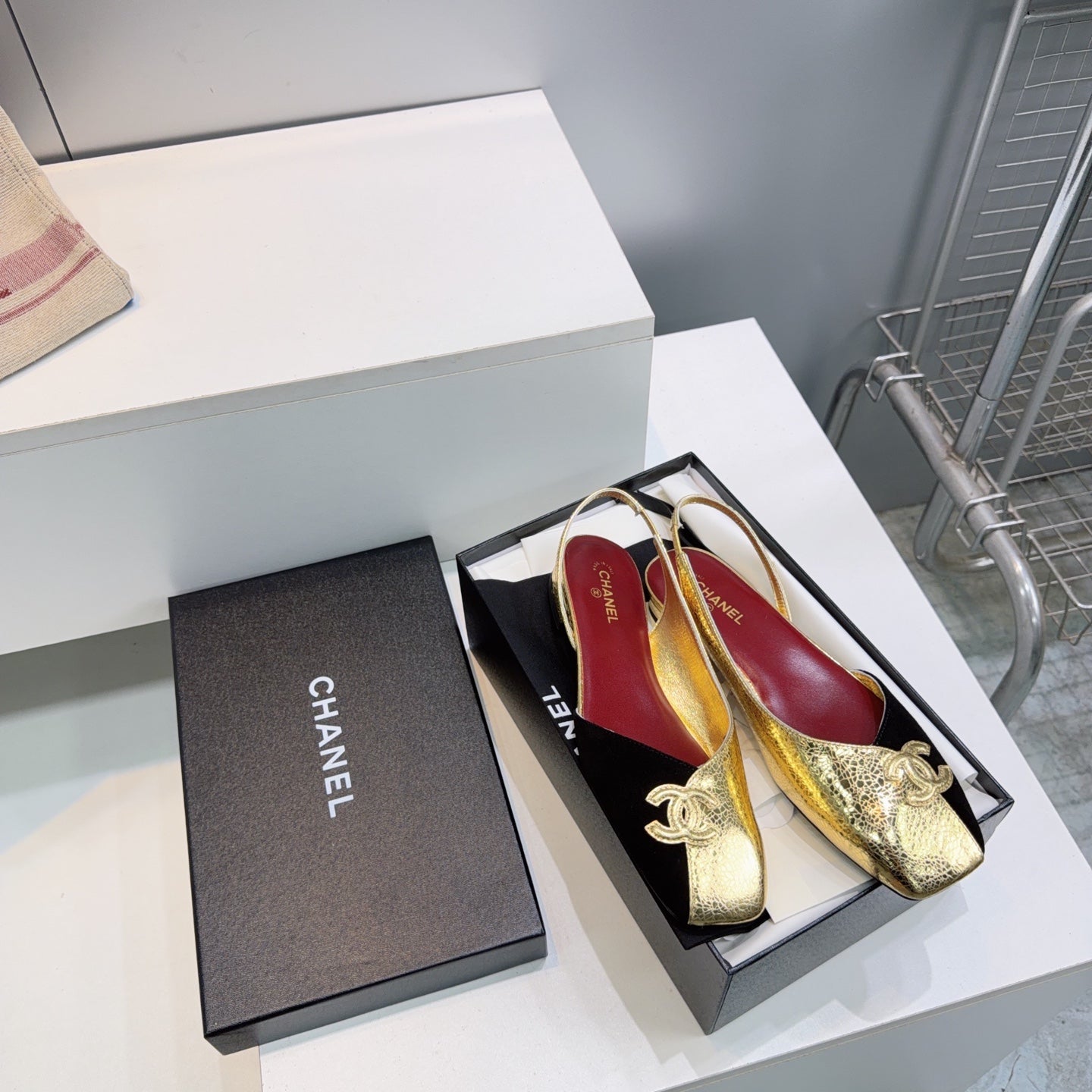 CHANEL 26S FLAT SLINGBACK IN GOLD LAMBSKIN AND BLACK SUEDE