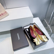 CHANEL 26S SQUARE-TOE FLATS IN GOLD LAMBSKIN AND BLACK SUEDE