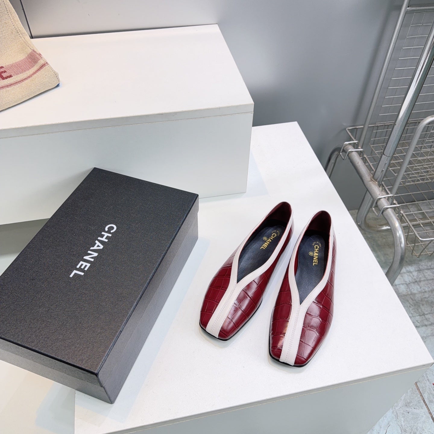 CHANEL 26S SQUARE-TOE FLATS IN RED CROCODILE-EMBOSSED LAMBSKIN WITH WHITE TRIM