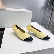 CHANEL 26S COLOR-BLOCK HIGH HEELS 45 MM IN YELLOW AND BLACK LAMBSKIN
