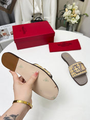 Vlogo embellished leather-trimmed raffia slides grey