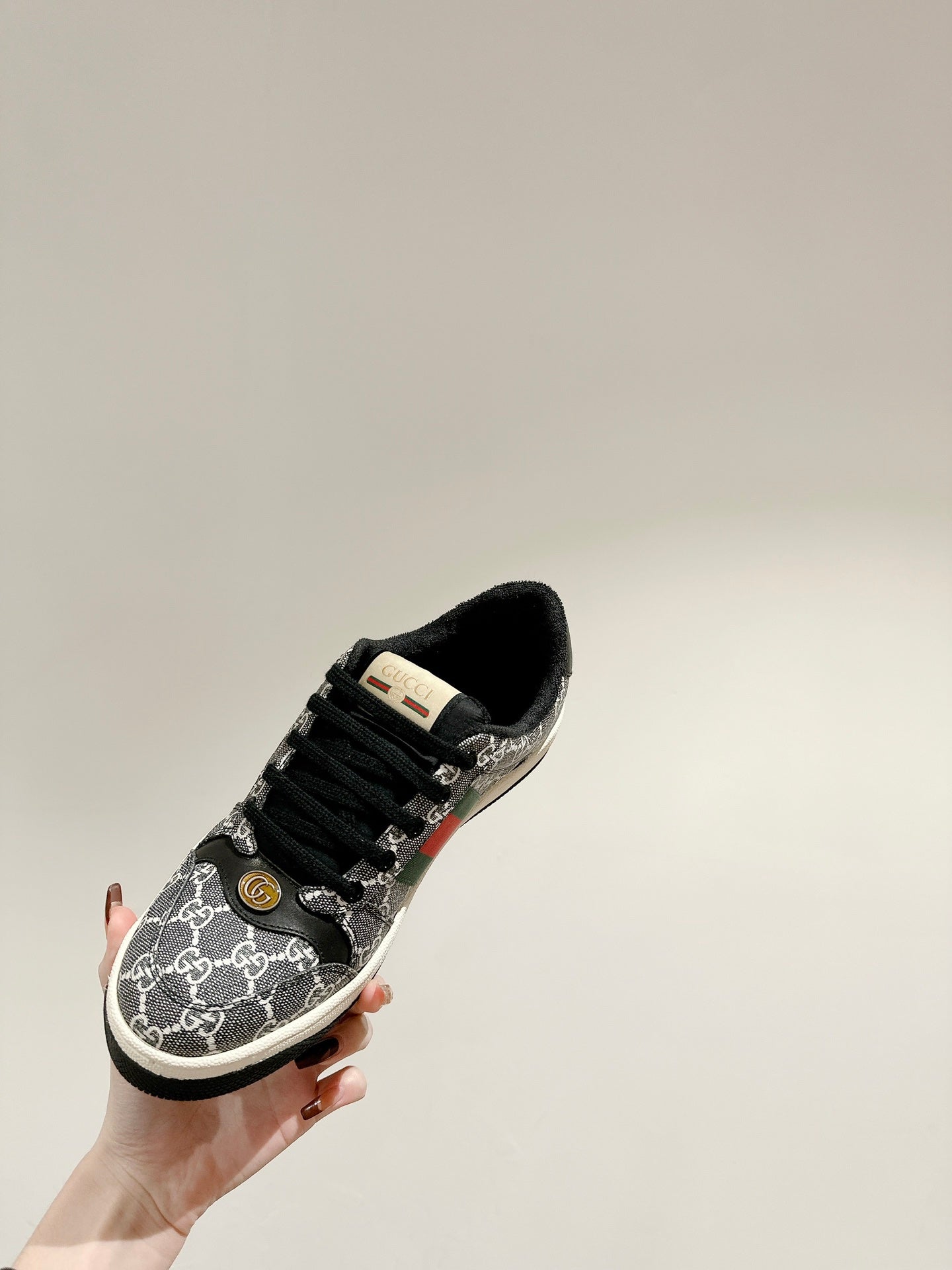 GUCCI 26S SCREENER SNEAKER IN BLACK AND WHITE GG CANVAS