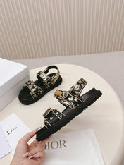 DIOR BACK-STRAP SANDALS 25S IN BLACK AND GOLD CALFSKIN WITH BUTTERFLY MOTIF