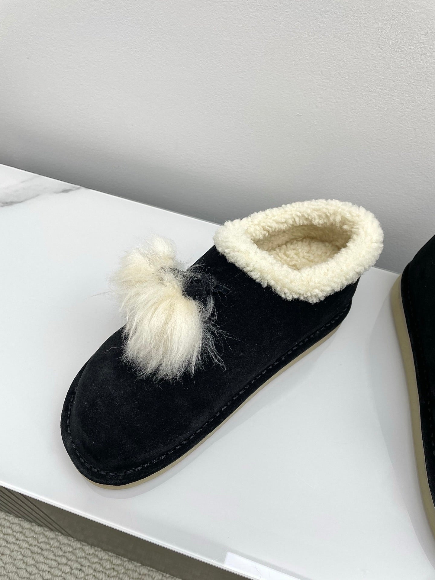 MIUMIU 26S ANKLE SHEARLING BOOTS IN BLACK SUEDE