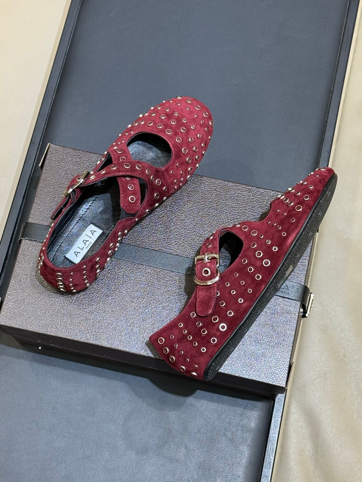 ALAIA 26S CROSS-STRAP FLATS IN DARK RED SUEDE WITH SILVER HARDWARE