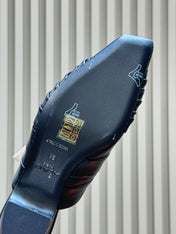 ALAIA 26S PLEATED MULES IN BLACK LAMBSKIN