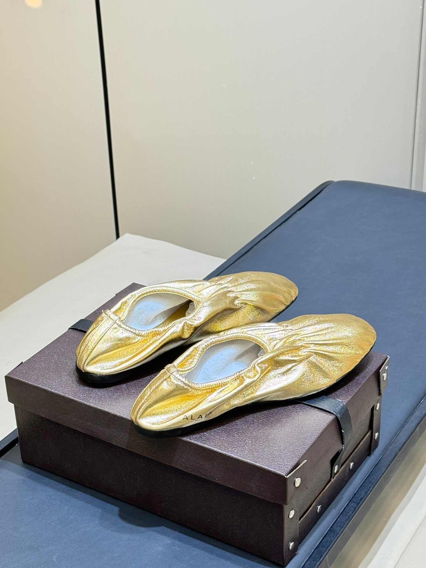 ALAIA 26S BALLET FLATS IN GOLD LAMBSKIN
