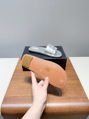 ALAIA FLAT SANDALS WITH PERFORATED STRAPS 25S IN SILVER LAMBSKIN