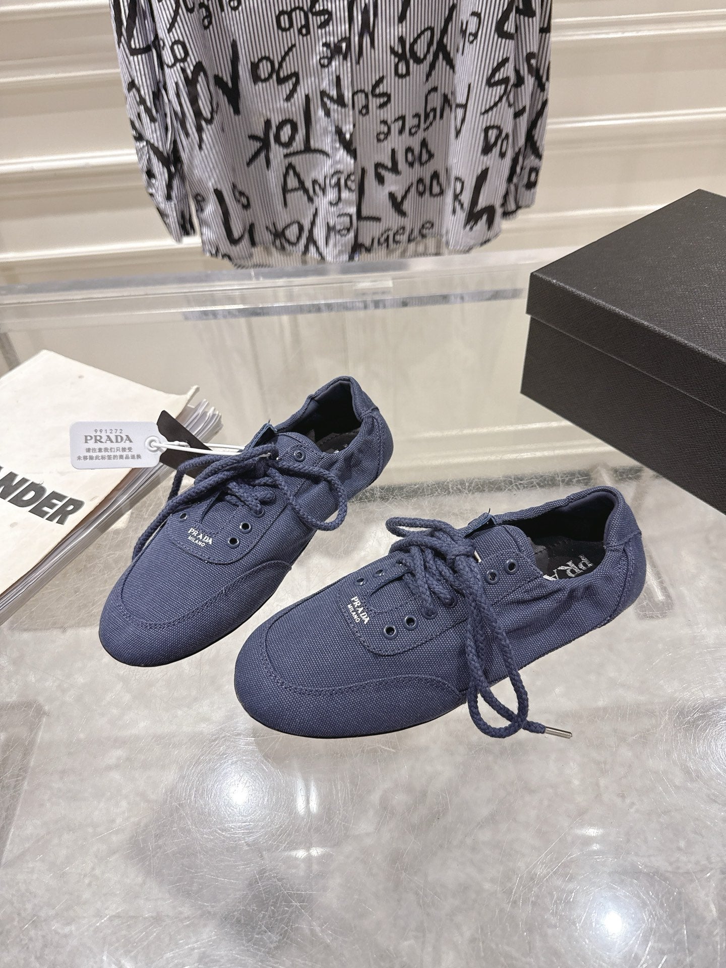 PRADA 26S COLLAPSE SNEAKERS IN BLUE CANVAS