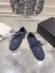 PRADA 26S COLLAPSE SNEAKERS IN BLUE CANVAS