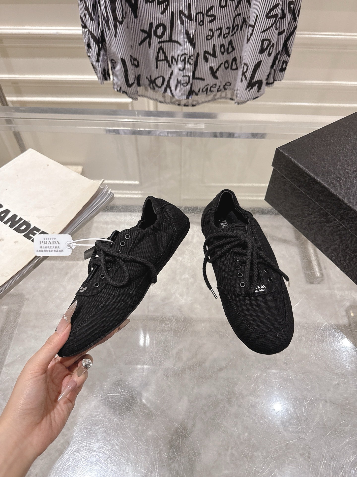 PRADA 26S COLLAPSE SNEAKERS IN BLACK CANVAS
