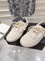 PRADA 26S COLLAPSE SNEAKERS IN WHITE CANVAS
