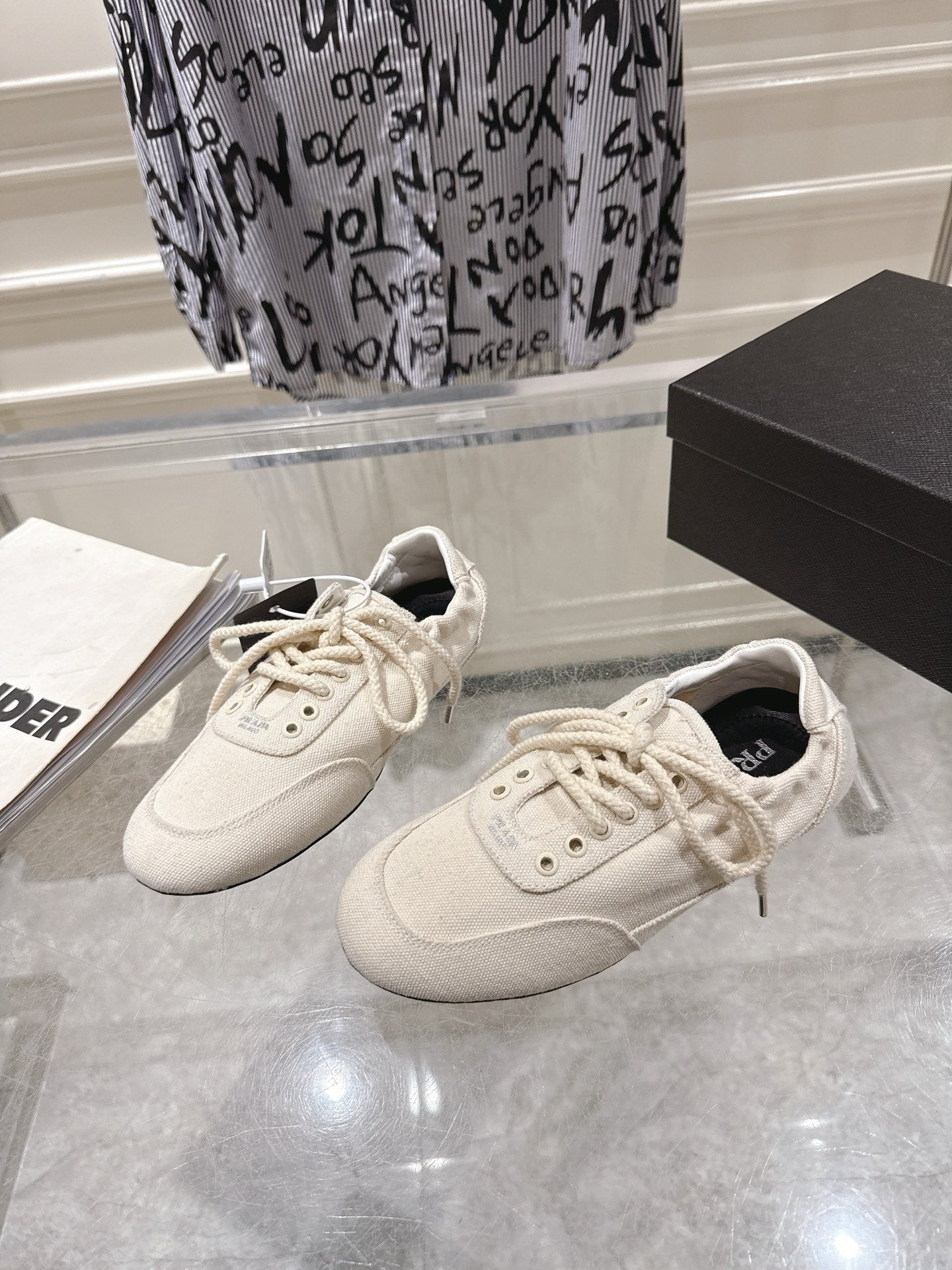PRADA 26S COLLAPSE SNEAKERS IN WHITE CANVAS