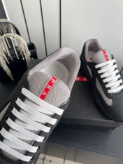 PRADA 26S AMERICA CUP SNEAKERS IN BLACK SOFT RUBBER AND BIKE FABRIC