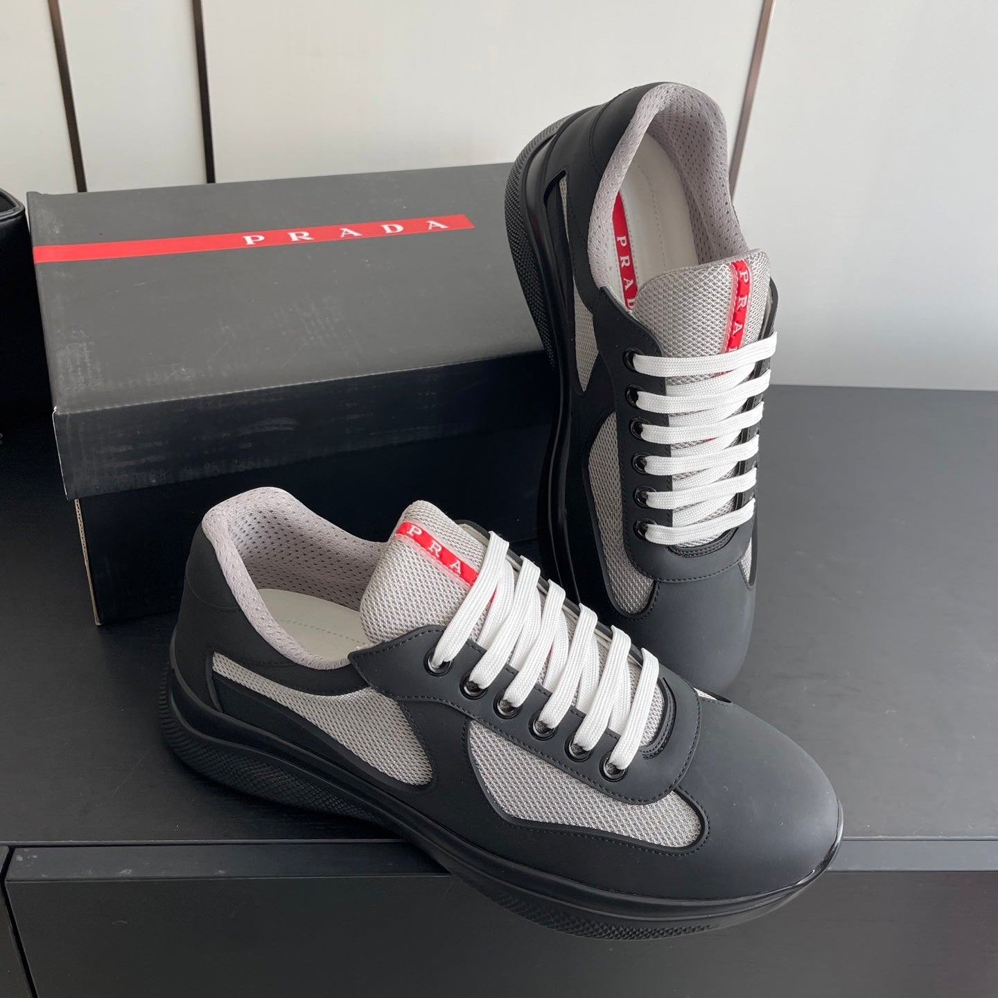 PRADA 26S AMERICA CUP SNEAKERS IN BLACK SOFT RUBBER AND BIKE FABRIC