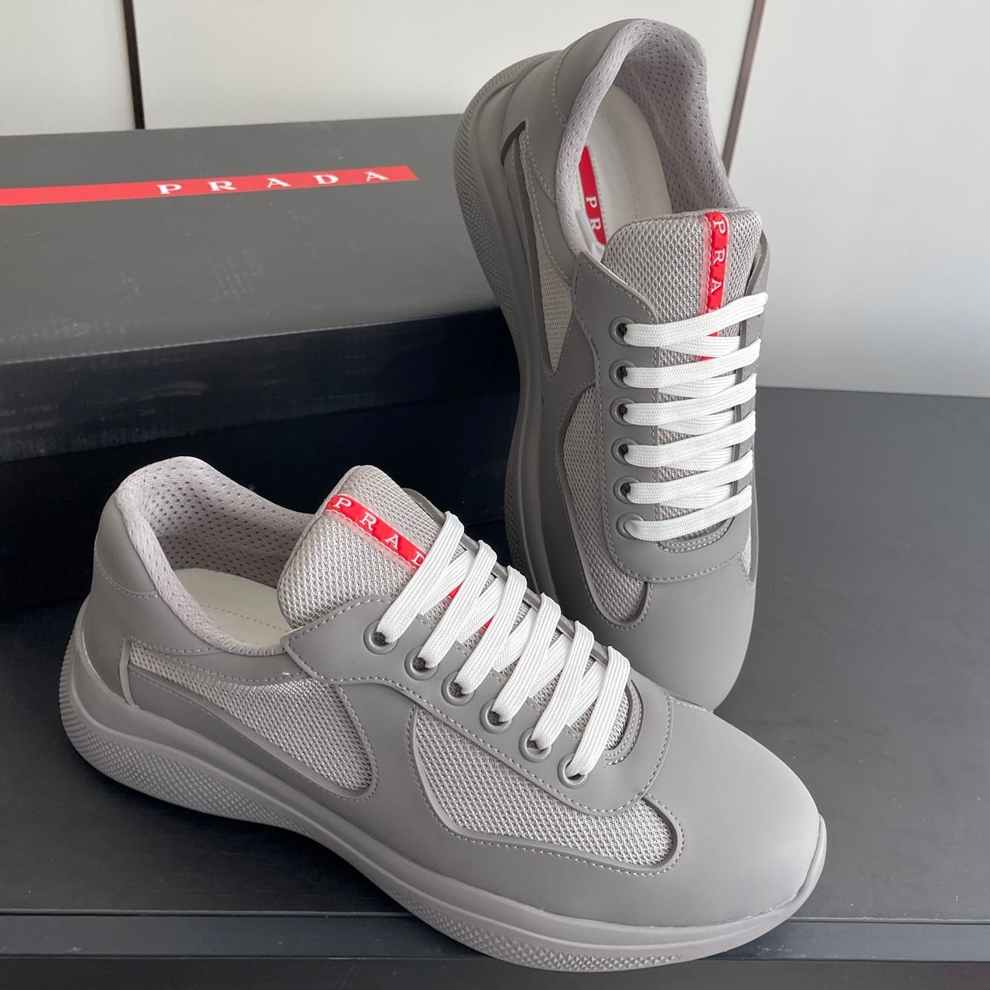 PRADA 26S AMERICA CUP SNEAKERS IN COOL GRAY SOFT RUBBER AND BIKE FABRIC