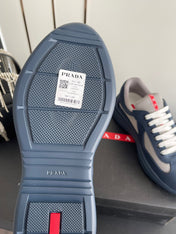 PRADA 26S AMERICA CUP SNEAKERS IN SLATE BLUE SOFT RUBBER AND BIKE FABRIC