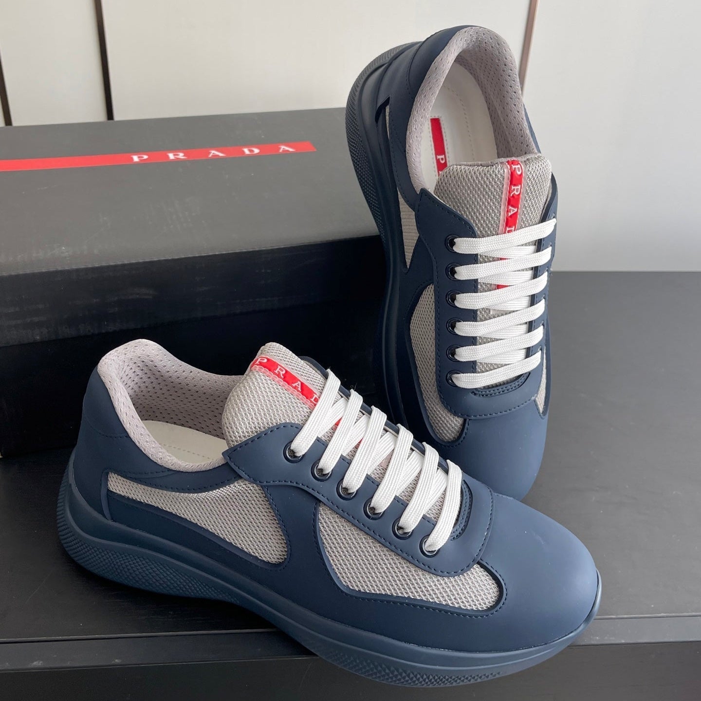 PRADA 26S AMERICA CUP SNEAKERS IN SLATE BLUE SOFT RUBBER AND BIKE FABRIC