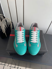 PRADA 26S AMERICA CUP SNEAKERS IN TEAL BLUE SOFT RUBBER AND BIKE FABRIC
