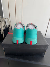 PRADA 26S AMERICA CUP SNEAKERS IN TEAL BLUE SOFT RUBBER AND BIKE FABRIC