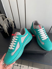 PRADA 26S AMERICA CUP SNEAKERS IN TEAL BLUE SOFT RUBBER AND BIKE FABRIC