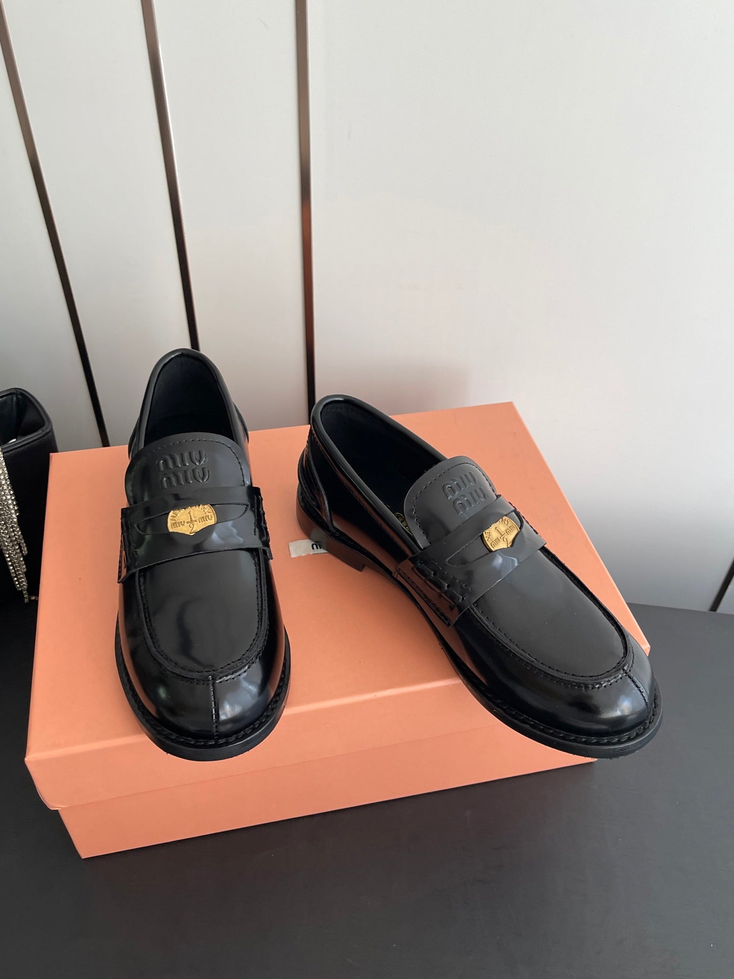 MIUMIU 26S PENNY LOAFERS IN BLACK GLOSSY CALFSKIN GOLD HARDWARE