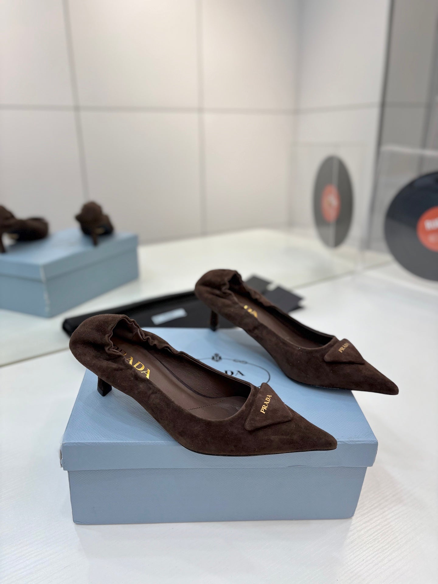 PRADA 26S PUMPS 55MM IN DARK BROWN SUEDE WITH LOGO