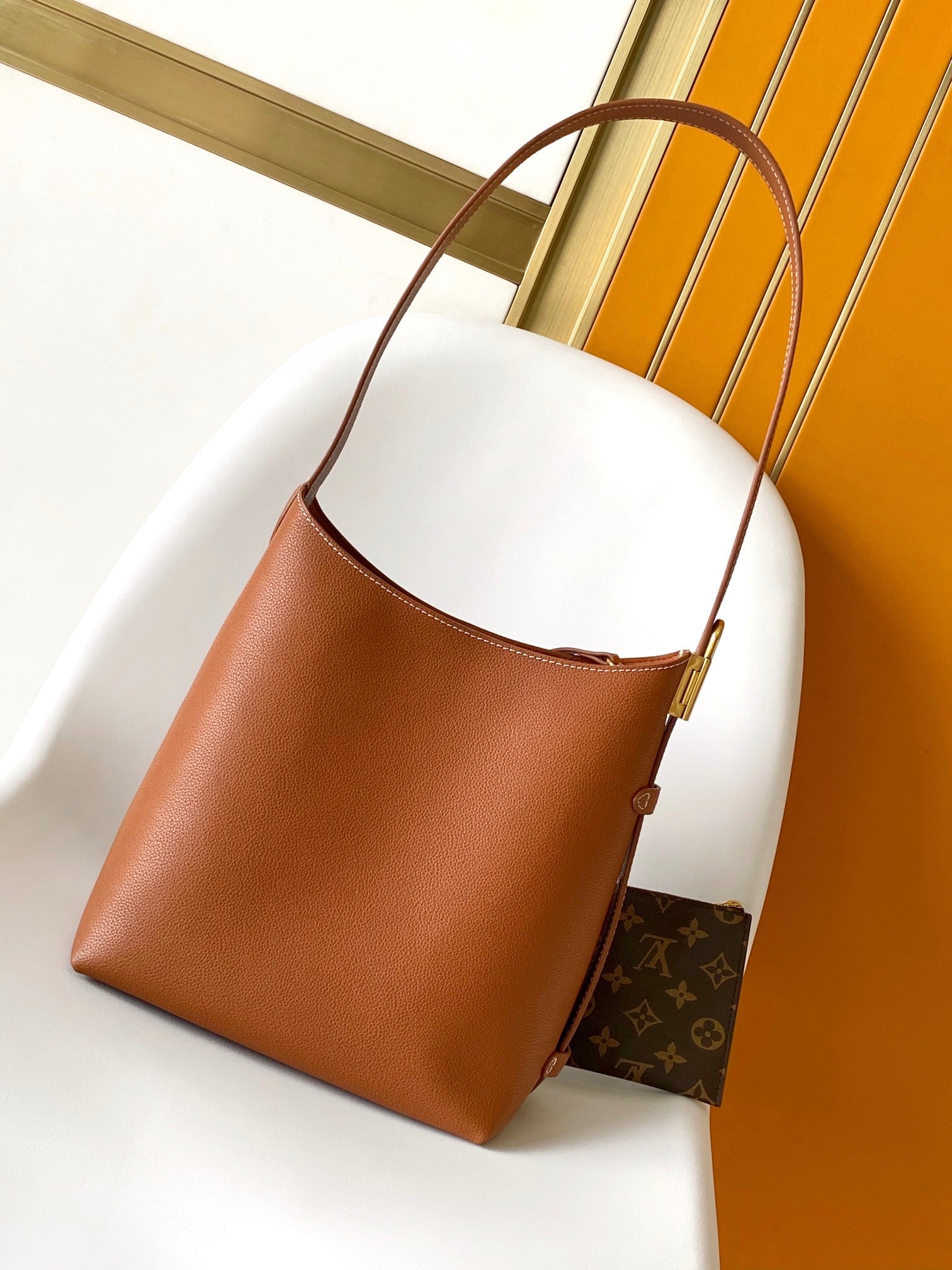 LV 25S LOW KEY HOBO BAG 35 CM IN BURNT ORANGE CALFSKIN
