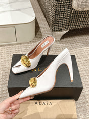 ALAIA SPIKE JEWEL MULES IN WHITE CALFSKIN WITH GOLD HARDWARE