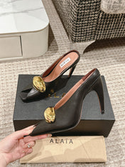 ALAIA SPIKE JEWEL MULES IN BLACK CALFSKIN WITH GOLD HARDWARE