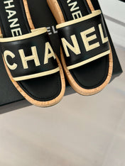 THICK SOLE LETTER SLIPPERS IN BLACK SHEEPSKIN