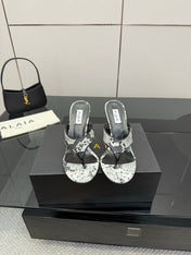 ALAIA HEELED THONG 25S IN WHITE AND BLACK LAMBSKIN SNAKE-EMBOSSED