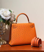 KELLY SELLIER 25 BAG IN FIRE ORANGE OSTRICH LEATHER WITH GOLD HARDWARE