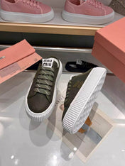 MIUMIU 26S SNEAKER MULES 45MM IN DARK OLIVE GREEN MESH