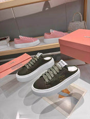 MIUMIU 26S SNEAKER MULES 45MM IN DARK OLIVE GREEN MESH
