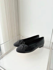 CHANEL 26S BALLET FLATS IN BLACK CALFSKIN WITH FABRIC TOE CAP AND BOW