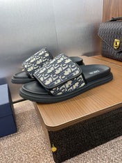 DIOR 25S ALIAS SLIDES IN BLACK CALFSKIN WITH CD OBLIQUE DEEP BLUE LOGO