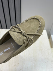 MIUMIU 26S SNEAKER MULES IN DARK OLIVE GREEN SUEDE WITH BOW