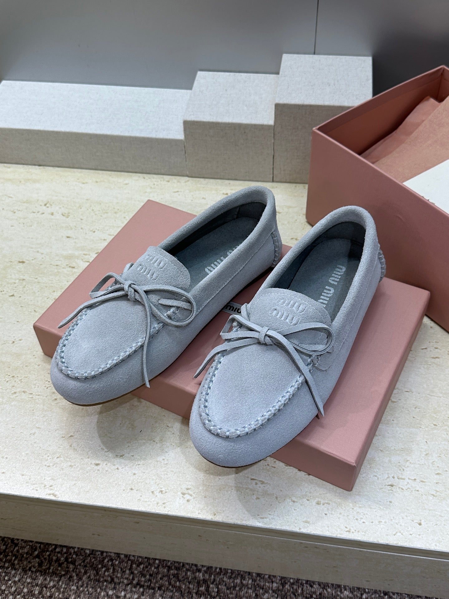 MIUMIU 26S LOAFERS IN LIGHT BLUE SUEDE WITH BOW