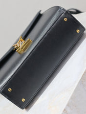 CASSANDRA MINI TOP HANDLE BAG 20 IN BLACK CALFSKIN GOLD HARDWARE