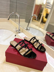 VALENTINO 26S ROCKSTUD CAGED SANDALS IN BLACK PATENT CALFSKIN